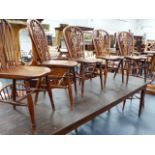 A HARLEQUIN SET OF ELEVEN YEW WOOD, BEECH AND ELM WINDSOR CHAIRS WITH FLEUR DE LYS PANEL BACKS TO