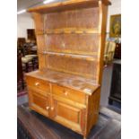 A MINIATURE VICTORIAN STYLE PINE KITCHEN DRESSER. H.57cms.