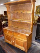 A MINIATURE VICTORIAN STYLE PINE KITCHEN DRESSER. H.57cms.