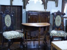 AN UNUSUAL PAIR OF CARVED WALNUT HALL CHAIRS WITH LION HEAD FINIALS TOGETHER WITH A VICTORIAN
