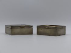 A PAIR OF WHITE METAL WOOD LINED HINGED BOXES WITH EQUESTRIAN SCENES. APPROXIMATE MEASUREMENTS 9.