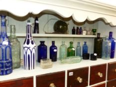 A QUANTITY OF VINTAGE GLASS BOTTLES, DECANTERS,ETC.