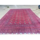 A LARGE AFGHAN BOKHARA CARPET. 410 X 560CM