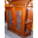 A VICTORIAN MAHOGANY LARGE WALL HANGING CABINET WITH TWO CARVED PANEL DOORS.