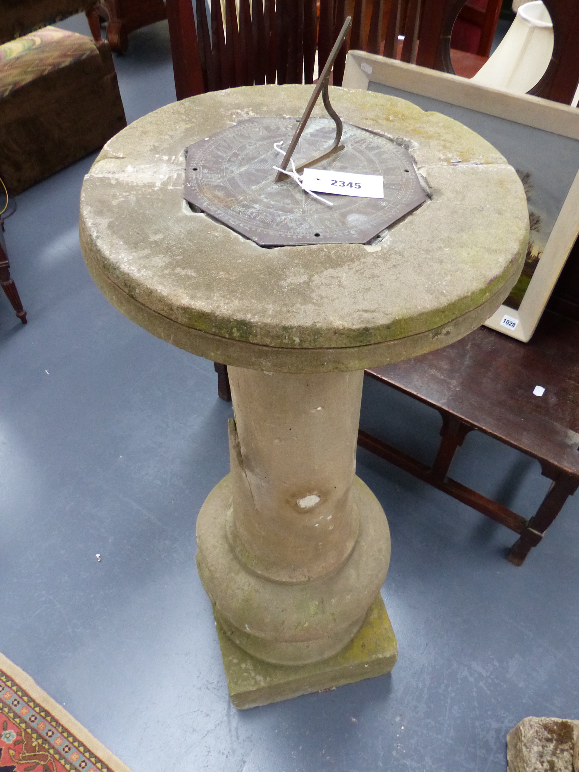 AN EARLY CARVED STONE SUNDIAL PLINTH WITH ASSOCIATED ENGRAVED BRASS SUNDIAL WITH INSCRIPTION SINE