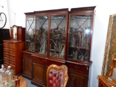 A MAHOGANY GEORGIAN AND LATER ASTRAGAL GLAZED FOUR DOOR BREAKFRONT BOOKCASE WITH DENTIL CORNICE,