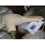A WELL CARVED 19th.C.IVORY HANDLE MODELLED AS A BIRD'S HEAD, POSSIBLY A STORK OR HERON. W.14.5cms.