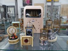 A RARE BAKELITE CLOCK AUTOMATON TOGETHER WITH VARIOUS NOVELTY CLOCKS,ETC