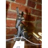 A BRONZE FIGURE OF A SEATED HARE WITH IMPRESSED MONOGRAM TO BASE. H.14cms.