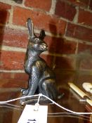 A BRONZE FIGURE OF A SEATED HARE WITH IMPRESSED MONOGRAM TO BASE. H.14cms.