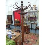 A VINTAGE BENTWOOD COAT AND UMBRELLA STAND IN THE MANNER OF THONET.