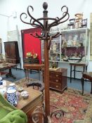 A VINTAGE BENTWOOD COAT AND UMBRELLA STAND IN THE MANNER OF THONET.