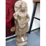 AN IMPRESSIVE INDIAN CARVED STONE FIGURE OF A STANDING DEITY. H.78cms.