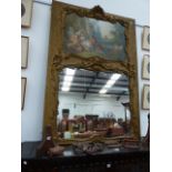 A LARGE FRENCH GILT FRAMED TRUMEAU MIRROR WITH OIL PAINTED PASTORAL SCENE WITHIN SCROLL BORDER. W.