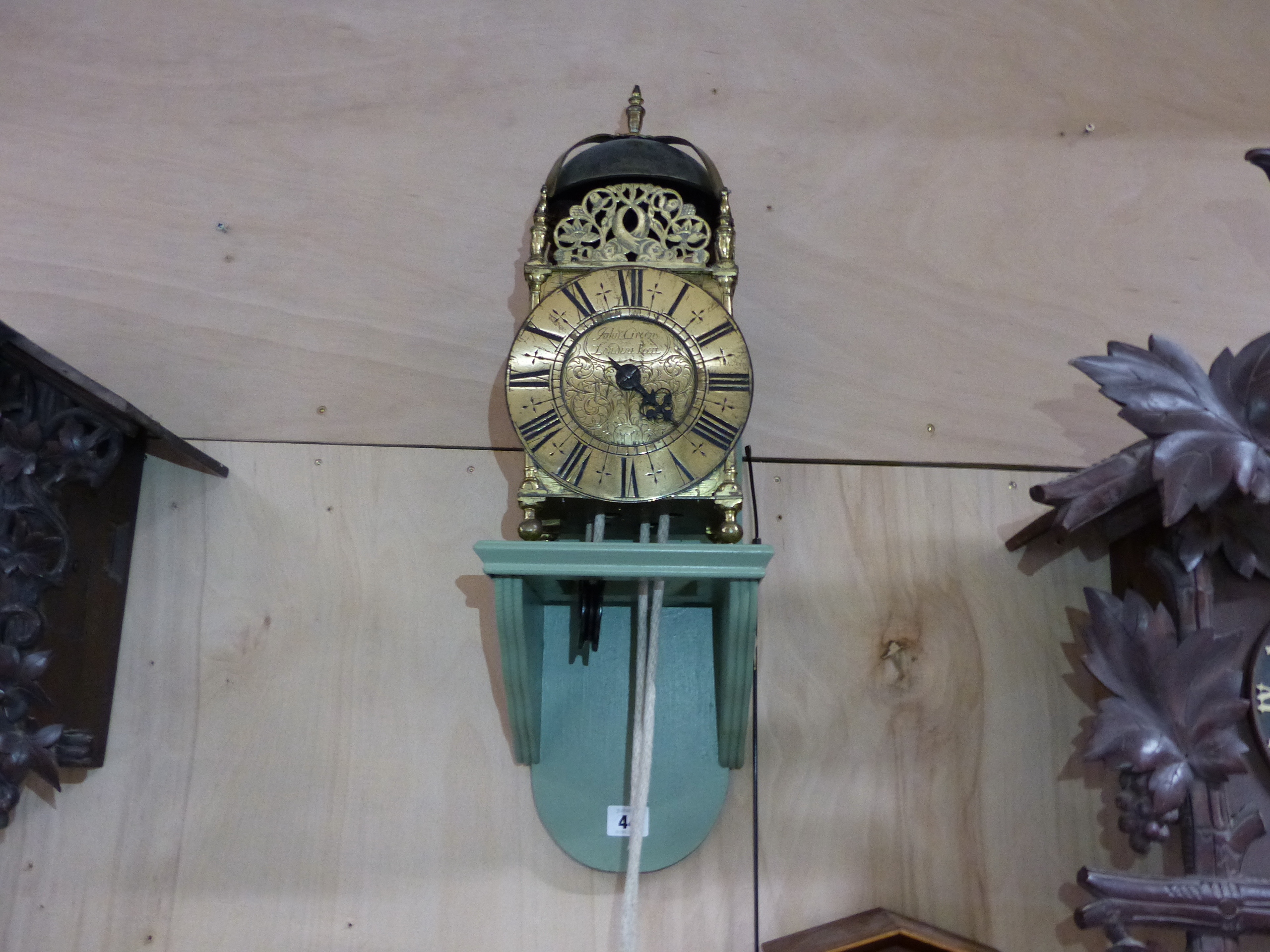 AN EARLY LANTERN CLOCK IN BRASS FRAME CASE. 6.5" DIAL SIGNED JOHN GREEN FECIT, LONDON MOUNTED ON