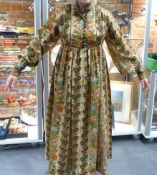 A GOOD VINTAGE LIBERTY'S PRINTED LINEN PLEATED AND BUTTONED DRESS IN THE EASTERN STYLE.