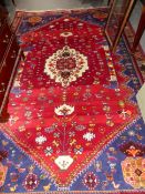 A PERSIAN SHIRAZ CARPET. 276 x 185cms.