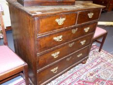 AN 18th.C.AND LATER WALNUT AND OAK CROSSBANDED CHEST OF TWO SHORT AND THREE LONG DRAWERS ON BUN