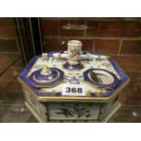 A CONTINENTAL OCTAGONAL ENCRIER DECORATED IN THE FAMILLE ROSE PALETTE WITH LIDDED COMPARTMENTS,