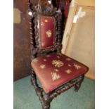 A VICTORIAN CARVED OAK JACOBEAN REVIVAL HIGH BACK CHILD'S CHAIR.