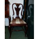 A GROUP OF THREE GEO.I. STYLE MAHOGANY SPLAT BACK SIDE CHAIRS ON CABRIOLE LEGS.