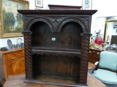 A SMALL 17th.C.AND LATER OAK NICHE WALL SHELF WITH CARVED ARCH DECORATION. W.60 x H.62cms.