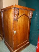 A PAIR OF VICTORIAN OAK BEDSIDE CABINETS WITH GOTHIC PANEL DOORS. W.45 x H.80cms.