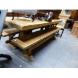 A LARGE HAND MADE PINE REFECTORY STYLE TABLE ON TRESTLE BASE TOGETHER WITH A PAIR OF MATCHING FORMS.