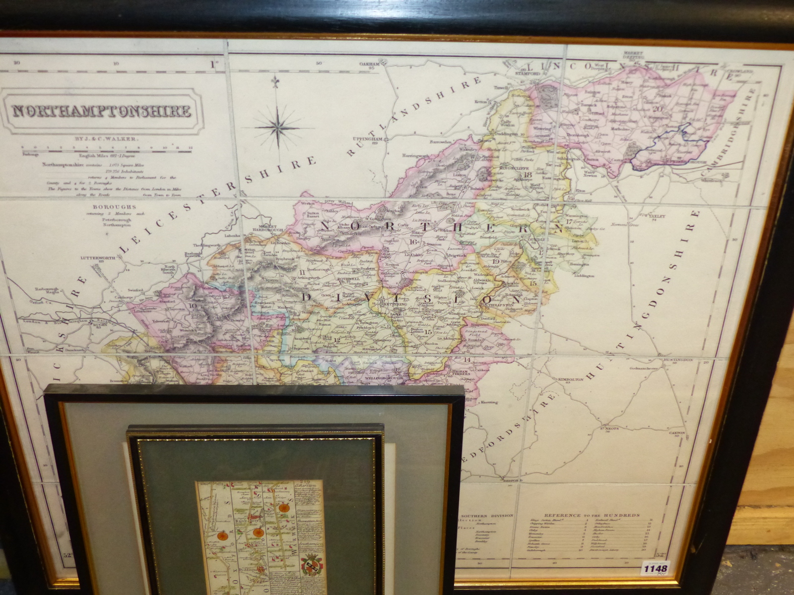 A HAND COLOURED FOLDING MAP OF NORTHAMPTONSHIRE BY J. & C. WALKER, FRAMED, 58 x 58cms TOGETHER