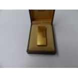A DUNHILL GOLD PLATED CASE LIGHTER.