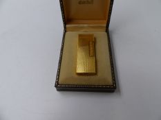 A DUNHILL GOLD PLATED CASE LIGHTER.