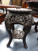 A SMALL CHINESE MARBLE TOP CARVED HARDWOOD STAND OF CIRCULAR FORM. H.46cms.