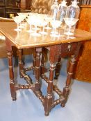 A SMALL 18th.C.OAK COTTAGE GATELEG OCCASIONAL TABLE. 60 x 66cms (EXTENDED) H.59cms.