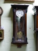 A VICTORIAN VIENNA WALL CLOCK IN MAHOGANY EBONISED CASE, WHITE ENAMEL TWO PIECE DIAL WITH SUBSIDIARY