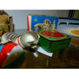 A GNK WEST GERMAN TINPLATE CLOCKWORK CAT AND BALL TOY COMPLETE WITH CARD BOX TOGETHER WITH AN