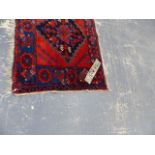 AN UNUSUAL PERSIAN SERAB SMALL RUG 138x60cms TOGETHER WITH AN ANTIQUE PERSIAN AFSHAR BAG FACE.