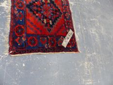 AN UNUSUAL PERSIAN SERAB SMALL RUG 138x60cms TOGETHER WITH AN ANTIQUE PERSIAN AFSHAR BAG FACE.