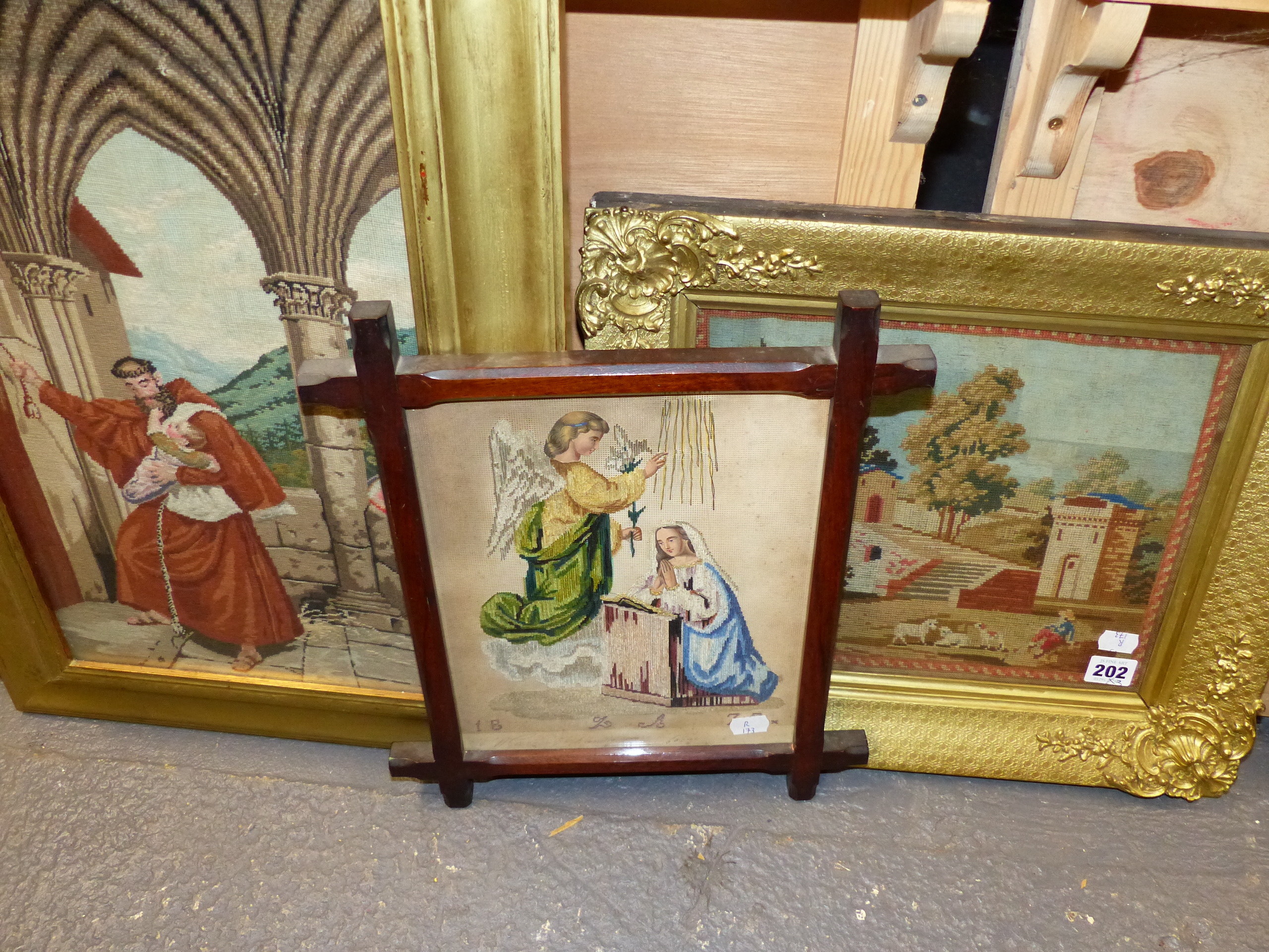 THREE VICTORIAN NEEDLEPOINT PANELS, A CLASSICAL LANDSCAPE, THE ARCHANGEL AND MARY TOGETHER WITH