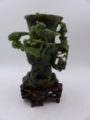 TWO CHINESE CARVED HARDSTONE VASES, A ROSE QUARTZ EXAMPLE WITH DRAGON DECORATED COVER ( H.28.5cms)