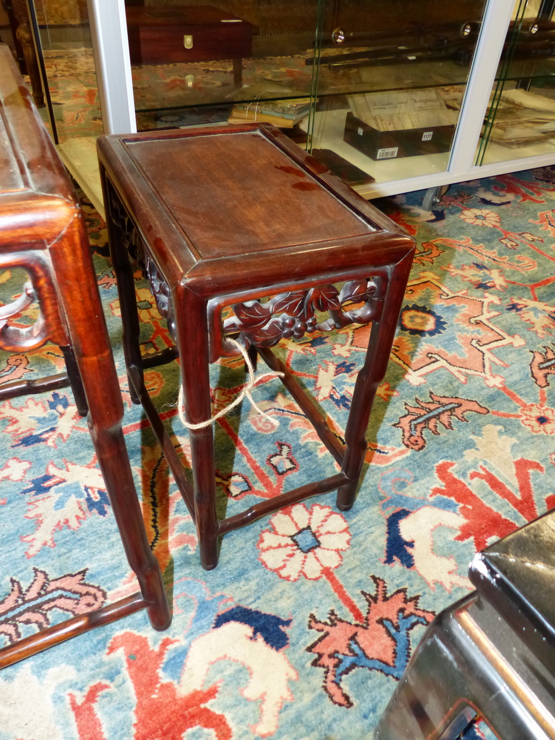 A NEST OF FOUR CHINESE CARVED HARDWOOD TABLES WITH PIERCED FOLIATE APRONS. - Image 6 of 19