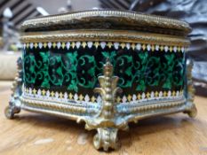 AN ANTIQUE FRENCH ENAMEL ORMOLU MOUNTED CARTOUCHE FORM DRESSER BOX, THE TOP DECORATED WITH OVAL