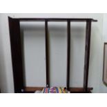 AN ANTIQUE OAK WALL HANGING PLATE RACK. W.110cms.