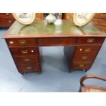 A 19th.C.MAHOGANY PEDESTAL WRITING TABLE OF CAMPAIGN TYPE WITH BRASS RECESSED HANDLES. W.127cms.