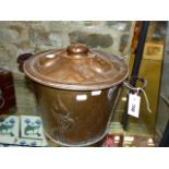 A VINTAGE ARTS AND CRAFTS COPPER COVERED TWO HANDLED COAL BUCKET.