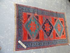 AN ANTIQUE CAUCASIAN TRIBAL RUG. 188x118cms.