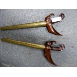 TWO MALAYSIAN KRIS WITH WOOD HANDLES AND BRASS WRAPPED SCABBARDS