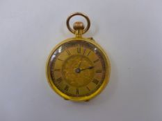 AN 18K STAMPED YELLOW GOLD OPEN FACE LATE VICTORIAN LADIES FOB WATCH. NUMBERS INSIDE OF CASE 254535,