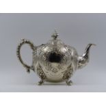 A VICTORIAN EMBOSSED HALLMARKED SILVER THREE PIECE TEA SET 1865 LONDON ROBERT HENNELL III,