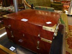 AN ANTIQUE BRASS BOUND MAHOGANY DECANTER BOX WITH FITTED INTERIOR TO INCLUDE TWO DECANTERS AND BRASS