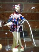 A LADY JESTER FIGURE BY ROYAL DOULTON INSCRIBED TO BASE AND NUMBERED HN/221. H.17cms.